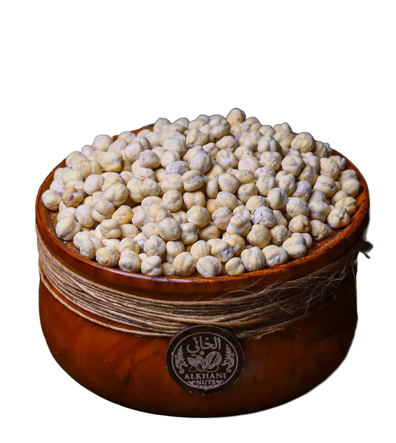 قضامة صفرا، حبات حمّص مدوّرة بلون بيج مصفر، بزبدية خشب ملفوفة بخيط خيش وعليها ختم الخاني